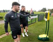 7 April 2022; The Football Association of Ireland and DHL Express Ireland, official logistics partner to the FAI, have come together to offer unique football experiences to young Irish fans suffering with illness, injury or incapacitation, using the new FAI BEAM Robot sponsored by DHL. At the launch of the experience are Republic of Ireland players Scott Hogan, left, and Conor Hourihane at the FAI National Training Centre in Abbotstown, Dublin. Photo by Stephen McCarthy/Sportsfile