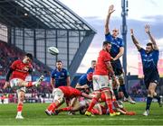 2 April 2022; Conor Murray of Munster kicks under pressure from Devin Toner and Robbie Henshaw of Leinster during the United Rugby Championship match between Munster and Leinster at Thomond Park in Limerick. Photo by Harry Murphy/Sportsfile