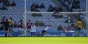 3 April 2022; Diarmuid Murtagh of Roscommon, 26 left, shoots past Owen Gallagher of Galway in the Galway goal, to score goal late in the game during the Allianz Football League Division 2 Final match between Roscommon and Galway at Croke Park in Dublin. Photo by Ray McManus/Sportsfile