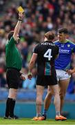 3 April 2022; Referee Noel Mooney issues a yellow card to Pádraig O'Hora of Mayo and David Clifford of Kerry during the Allianz Football League Division 1 Final match between Kerry and Mayo at Croke Park in Dublin. Photo by Ray McManus/Sportsfile