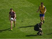 3 April 2022; Referee Niall Cullen ducks out of the way as Finnian Ó Laoí of Galway goes on the attack during the Allianz Football League Division 2 Final match between Roscommon and Galway at Croke Park in Dublin. Photo by Piaras Ó Mídheach/Sportsfile