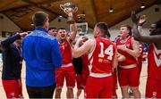 2 April 2022; UCC Demons captain Ryan Murphy and his teammates celebrate with the cup after the InsureMyVan.ie Division 1 Final match between EJ Sligo All-Stars and UCC Demons, Cork at the National Basketball Arena in Dublin. Photo by Brendan Moran/Sportsfile