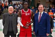 2 April 2022; Tala Fam Thiam of UCC Demons is presented with his Men's Division 1 Allstar award by Basketball Ireland board member Tony Burke, left, and Basketball Ireland chief executive John Feehan after the InsureMyVan.ie Division 1 Final match between EJ Sligo All-Stars and UCC Demons, Cork at the National Basketball Arena in Dublin. Photo by Brendan Moran/Sportsfile