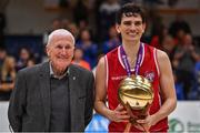 2 April 2022; Stevan Manojovic of UCC Demons is presented with the MVP by Basketball Ireland board member Tony Burke after the InsureMyVan.ie Division 1 Final match between EJ Sligo All-Stars and UCC Demons, Cork at the National Basketball Arena in Dublin. Photo by Brendan Moran/Sportsfile
