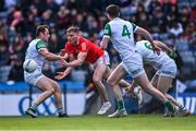 2 April 2022; Ciarán Byrne of Louth in action against Limerick players, from left, Darragh Treacy, Michael Donovan and Iain Corbett during the Allianz Football League Division 3 Final match between Louth and Limerick at Croke Park in Dublin. Photo by Piaras Ó Mídheach/Sportsfile