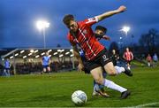 4 April 2022; Cameron McJannet of Derry City in action against Sean Brennan of UCD during the SSE Airtricity League Premier Division match between UCD and Derry City at UCD Bowl in Dublin. Photo by Ramsey Cardy/Sportsfile