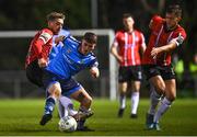 4 April 2022; Michael Gallagher of UCD is tackled by Jamie McGonigle of Derry City during the SSE Airtricity League Premier Division match between UCD and Derry City at UCD Bowl in Dublin. Photo by Ramsey Cardy/Sportsfile
