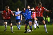 4 April 2022; Michael Gallagher of UCD in action against Jamie McGonigle, left, and Will Patching of Derry City during the SSE Airtricity League Premier Division match between UCD and Derry City at UCD Bowl in Dublin. Photo by Ramsey Cardy/Sportsfile