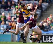 3 April 2022; Eddie Nolan of Roscommon is tackled by Matthew Tierney and Liam Silke, right, of Galway during the Allianz Football League Division 2 Final match between Roscommon and Galway at Croke Park in Dublin. Photo by Ray McManus/Sportsfile