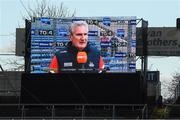 2 April 2022; Cork manager Kieran Kingston is seen on the new trial scoreboard as he is interviewed for TG4 before the Allianz Hurling League Division 1 Final match between Cork and Waterford at FBD Semple Stadium in Thurles, Tipperary. Photo by Ray McManus/Sportsfile