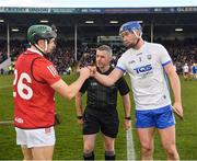 2 April 2022; Referee Liam Gordon looks on as the Waterford captain Conor Prunty and the Cork captain Mark Coleman greet each other before the Allianz Hurling League Division 1 Final match between Cork and Waterford at FBD Semple Stadium in Thurles, Tipperary. Photo by Ray McManus/Sportsfile