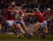 2 April 2022; Carthach Daly of Waterford is tackled by Darragh Fitzgibbon, left, and Ger Millerick of Cork during the Allianz Hurling League Division 1 Final match between Cork and Waterford at FBD Semple Stadium in Thurles, Tipperary. Photo by Ray McManus/Sportsfile