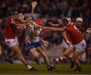 2 April 2022; Carthach Daly of Waterford is tackled by Darragh Fitzgibbon, left, and Ger Millerick of Cork during the Allianz Hurling League Division 1 Final match between Cork and Waterford at FBD Semple Stadium in Thurles, Tipperary. Photo by Ray McManus/Sportsfile