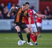 8 April 2022; Mark Connolly of Dundalk in action against Ronan Coughlan of St Patrick's Athletic during the SSE Airtricity League Premier Division match between St Patrick's Athletic and Dundalk at Richmond Park in Dublin. Photo by Ramsey Cardy/Sportsfile