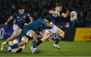 8 April 2022; Garry Ringrose of Leinster is tackled by Sammy Arnold and Leva Fifita of Connacht during the Heineken Champions Cup Round of 16 first leg match between Connacht and Leinster at the Sportsground in Galway. Photo by Brendan Moran/Sportsfile