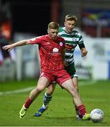 8 April 2022; Kameron Ledwidge of Shelbourne in action against Ronan Finn of Shamrock Rovers during the SSE Airtricity League Premier Division match between Shelbourne and Shamrock Rovers at Tolka Park in Dublin. Photo by Seb Daly/Sportsfile