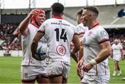 9 April 2022; Robert Baloucoune of Ulster, 14, celebrates with teammate Eric O'Sullivan, left, after scoring their side's first try during the Heineken Champions Cup Round of 16 first leg match between Toulouse and Ulster at Stade Ernest Wallon in Toulouse, France. Photo by Manuel Blondeau/Sportsfile