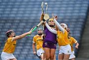 9 April 2022; Aoife Guiney of Wexford scores her side's first goal, under pressure from Antrim goalkeeper Catríona Graham, right, during the Littlewoods Ireland Camogie League Division 2 Final match between Antrim and Wexford at Croke Park in Dublin. Photo by Piaras Ó Mídheach/Sportsfile