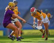 9 April 2022; Antrim goalkeeper Catríona Graham is tackled by Aoife Guiney of Wexford during the Littlewoods Ireland Camogie League Division 2 Final match between Antrim and Wexford at Croke Park in Dublin. Photo by Piaras Ó Mídheach/Sportsfile