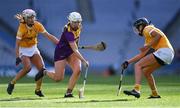 9 April 2022; Ciara O'Connor of Wexford in action against Antrim players Laoise McKenna, left, and Niamh Donnelly during the Littlewoods Ireland Camogie League Division 2 Final match between Antrim and Wexford at Croke Park in Dublin. Photo by Piaras Ó Mídheach/Sportsfile