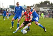 9 April 2022; Brandon Kavanagh of Derry City in action against Ryan Rainey and Barry McNamee of Finn Harps during the SSE Airtricity League Premier Division match between Finn Harps and Derry City at Finn Park in Ballybofey, Donegal. Photo by Oliver McVeigh/Sportsfile