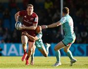 9 April 2022; Chris Farrell of Munster is tackled by Tom O'Flaherty of Exeter Chiefs during the Heineken Champions Cup Round of 16 first leg match between Exeter Chiefs and Munster at Sandy Park in Exeter, England. Photo by Harry Murphy/Sportsfile