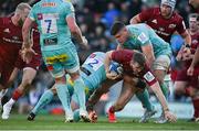 9 April 2022; Chris Farrell of Munster is tackled by Jack Yeandle and Dave Ewers of Exeter Chiefs during the Heineken Champions Cup Round of 16 first leg match between Exeter Chiefs and Munster at Sandy Park in Exeter, England. Photo by Harry Murphy/Sportsfile