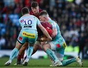 9 April 2022; John Hodnett of Munster is tackled by Joe Simmons and Jacques Vermeulen of Exeter Chiefs during the Heineken Champions Cup Round of 16 first leg match between Exeter Chiefs and Munster at Sandy Park in Exeter, England. Photo by Harry Murphy/Sportsfile