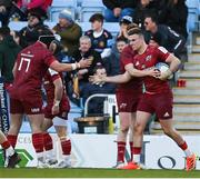 9 April 2022; Shane Daly of Munster, right, celebrates after scoring his side's first try during the Heineken Champions Cup Round of 16 first leg match between Exeter Chiefs and Munster at Sandy Park in Exeter, England. Photo by Harry Murphy/Sportsfile