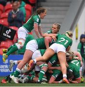 10 April 2022; Katie O’Dwyer of Ireland, hidden, celebrates with teammates after scoring her side's fourth try during the Tik Tok Women's Six Nations Rugby Championship match between Ireland and Italy at Musgrave Park in Cork. Photo by Eóin Noonan/Sportsfile