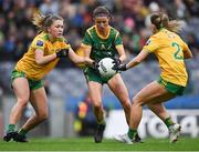 10 April 2022; Niamh O'Sullivan of Meath in action against Donegal players Tara Hegarty, left, and Niamh Carr during the Lidl Ladies Football National League Division 1 Final between Donegal and Meath at Croke Park in Dublin. Photo by Piaras Ó Mídheach/Sportsfile