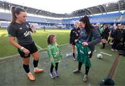 11 April 2022; Republic of Ireland's Áine O'Gorman, right, and Katie McCabe present a signed jersey to supporter Annie Mulholland, from Newbridge, Kildare, who celebrated her 7th birthday on Sunday and was invited by the FAI to visit the Republic of Ireland team's training session at Gamla Ullevi in Gothenburg, Sweden. Photo by Stephen McCarthy/Sportsfile