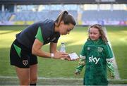 11 April 2022; Republic of Ireland captain Katie McCabe presents matchday tickets to supporter Annie Mulholland, from Newbridge, Kildare, who celebrated her 7th birthday on Sunday and was invited by the FAI to visit the Republic of Ireland team's training session at Gamla Ullevi in Gothenburg, Sweden. Photo by Stephen McCarthy/Sportsfile