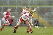28 March 2004; Vincent Owens, Tyrone, in action against Louth's Alan Myres. Allianz National Hurling League Division 3B, Round 5, Tyrone v Louth, Healy Park, Omagh, Co. Tyrone. Picture credit; Ray McManus / SPORTSFILE *EDI*