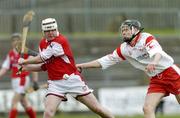 28 March 2004; Ger Collins, Louth, in action against Tyrone's Joseph O'Neill. Allianz National Hurling League Division 3B, Round 5, Tyrone v Louth, Healy Park, Omagh, Co. Tyrone. Picture credit; Ray McManus / SPORTSFILE *EDI*