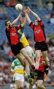 2 May 2004; Gregory McCartan, right, and Dan Gordan Down, in action against Ciaran McManus, Offaly. Allianz National Football League 2004 Division 2 Final, Offaly v Down, Croke Park, Dublin. Picture credit; Damien Eagers / SPORTSFILE *EDI*