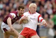 25 April 2004; Owen Mulligan, Tyrone, in action against Gary Fahey, Galway. Allianz Football League 2004, Semi-Final Replay, Galway v Tyrone, Pearse Stadium, Galway. Picture credit; Brian Lawless / SPORTSFILE *EDI*