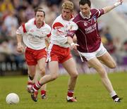 25 April 2004; Sean O'Domhnaill, Galway, in action against Kevin Hughes, Tyrone. Allianz Football League 2004, Semi-Final Replay, Galway v Tyrone, Pearse Stadium, Galway. Picture credit; Brian Lawless / SPORTSFILE *EDI*
