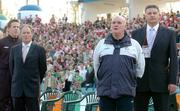 28 April 2004; Republic of Ireland manager Brian Kerr, left, with assistant coach Noel O'Reilly and security officer Derek McGuinness, right,  stand for the national anthem before the start of the game. Friendly International, Poland v Republic of Ireland, Bydgoszcz, Poland. Picture credit; David Maher / SPORTSFILE *EDI*