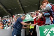 4 August 2013; Aston Villa manager Paul Lambert signs an autograph for supporters before the start of the game against Shamrock Rovers. Friendly, Shamrock Rovers v Aston Villa, Tallaght Stadium, Tallaght, Co. Dublin. Picture credit: Matt Browne / SPORTSFILE