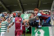 4 August 2013; Aston Villa supporter Andrew Kenny from Ranelagh, Dublin, high five with Christian Benteke before the start of the game against Shamrock Rovers. Friendly, Shamrock Rovers v Aston Villa, Tallaght Stadium, Tallaght, Co. Dublin. Picture credit: Matt Browne / SPORTSFILE