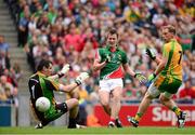 4 August 2013; Cillian O'Connor, Mayo, shoots to score his side's first goal past Donegal goalkeeper Paul Durcan, as Anthony Thompson, Donegal, looks on. GAA Football All-Ireland Senior Championship, Quarter-Final, Mayo v Donegal, Croke Park, Dublin. Photo by Sportsfile