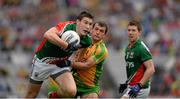 4 August 2013; Alan Freeman, Mayo, is tackled by Frank McGlynn, Donegal. GAA Football All-Ireland Senior Championship, Quarter-Final, Mayo v Donegal, Croke Park, Dublin. Picture credit: Ray McManus / SPORTSFILE