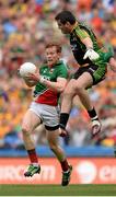 4 August 2013; Donal Vaughan, Mayo, on his way to scoring his side's second goal despite the tackle of Donegal goalkeeper Paul Durcan. GAA Football All-Ireland Senior Championship, Quarter-Final, Mayo v Donegal, Croke Park, Dublin. Picture credit: Stephen McCarthy / SPORTSFILE
