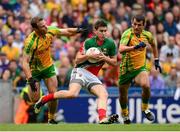 4 August 2013; Alan Freeman, Mayo, in action against Neil McGee, left, and Frank McGlynn, Donegal. GAA Football All-Ireland Senior Championship, Quarter-Final, Mayo v Donegal, Croke Park, Dublin. Photo by Sportsfile