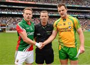 4 August 2013; Mayo captain Andy Moran shakes hands with Donegal captain Michael Murphy alongside referee Joe McQuillan before the start of the game. GAA Football All-Ireland Senior Championship, Quarter-Final, Mayo v Donegal, Croke Park, Dublin. Photo by Sportsfile