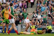 4 August 2013; Donegal's Ryan McHugh lies on the ground as Cillian O'Connor celebrates after scoring his third and Mayo's fourth goal. GAA Football All-Ireland Senior Championship, Quarter-Final, Mayo v Donegal, Croke Park, Dublin.  Picture credit: Ray McManus / SPORTSFILE