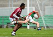 5 August 2013; Tommy Conroy, Mayo, in action against Israel Ilunga, Westmeath. Electric Ireland GAA Football All-Ireland Minor Championship Quarter-Final, Mayo v Westmeath, O'Connor Park, Tullamore, Co. Offaly. Picture credit: David Maher / SPORTSFILE