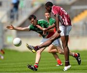5 August 2013; Sam Omokoro, Westmeath, in action against Val Roughneen, Mayo. Electric Ireland GAA Football All-Ireland Minor Championship Quarter-Final, Mayo v Westmeath, O'Connor Park, Tullamore, Co. Offaly. Picture credit: David Maher / SPORTSFILE