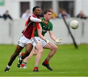 5 August 2013; Liam Irwin, Mayo, in action against Israel Ilunga, Westmeath. Electric Ireland GAA Football All-Ireland Minor Championship Quarter-Final, Mayo v Westmeath, O'Connor Park, Tullamore, Co. Offaly. Picture credit: David Maher / SPORTSFILE